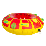 Side view of the Citrus towable tube, a red and yellow circular inflatable with green grab handles and a sunburst pattern.