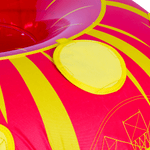 Close up of the Citrus towable tube, a red and yellow circular inflatable with green grab handles and a sunburst pattern.