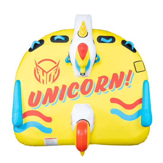 Top view of Unicorn, a yellow inflatable towable with "Unicorn!" printed in red and blue, showing the unicorn head and tail.