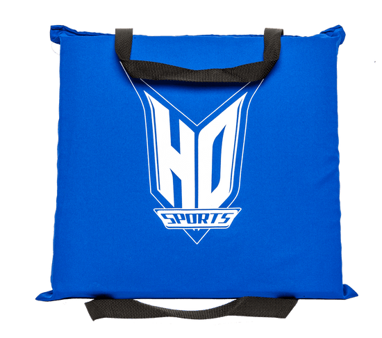 Front view of the blue Seat Cushion PFD with the white HO Sports logo, featuring black carrying straps on the top and bottom.