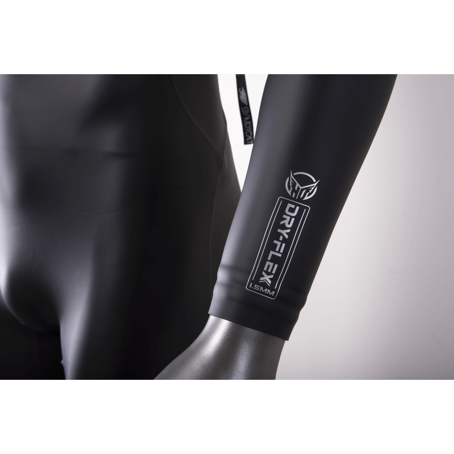 Close-up of the wetsuit sleeve, showing the Dry-Flex 1.5MM material with a sleek black finish and white logo.