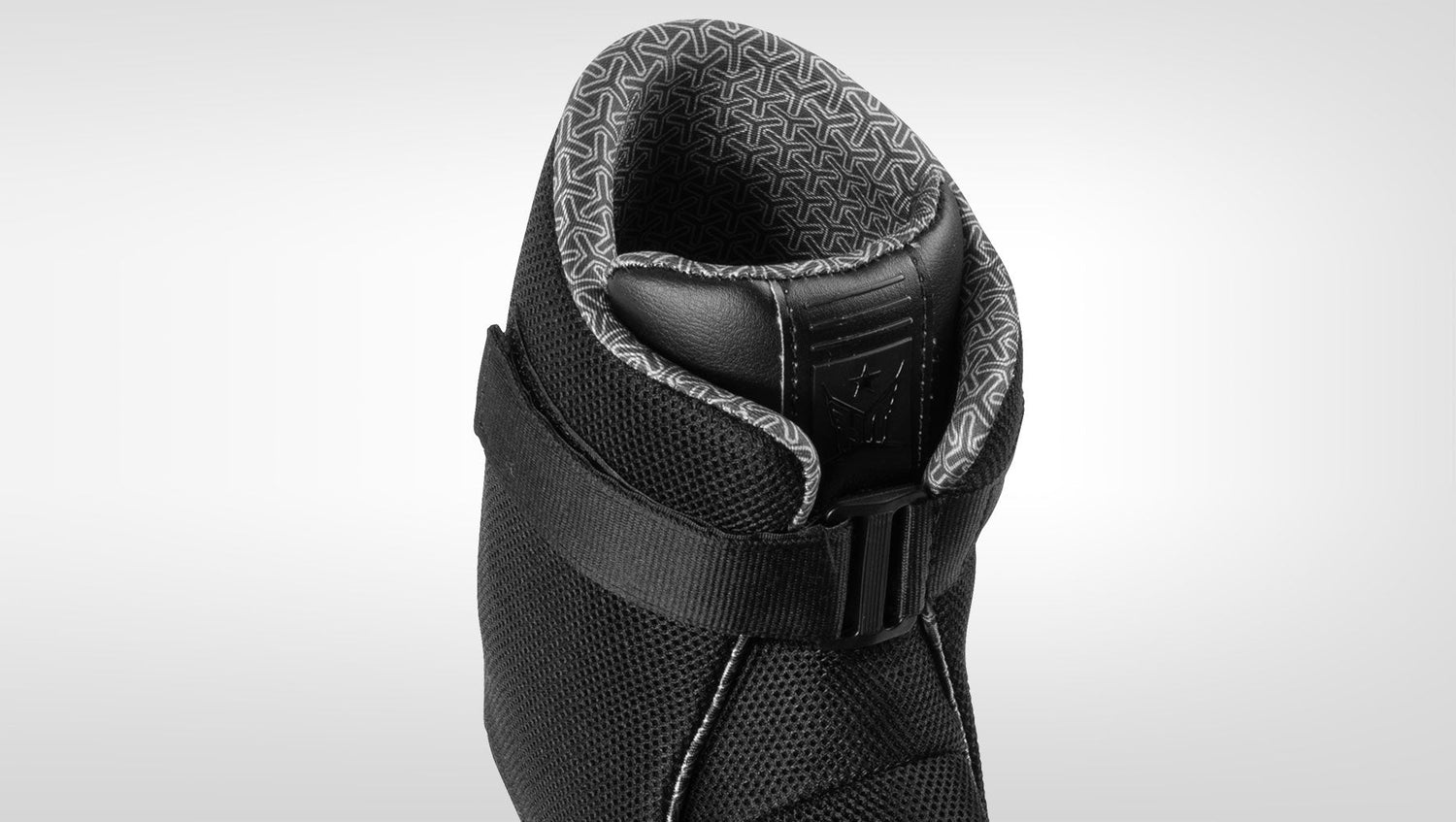 Close-up top view of Syndicate Hardshell Liner showing interior lining and ankle strap.