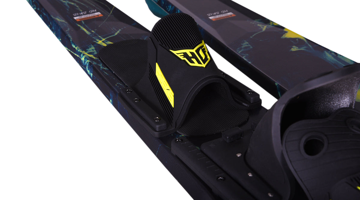 Close-up of a water ski with a yellow HO Sports brand logo on the back binding with a white background