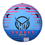 Top view of the round Sunset 2 towable tube, with a vibrant blue and pink gradient design, grab handles, and seating for two.