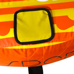 Close-up view of 2G Tube yellow square patch on striped orange and yellow fabric.