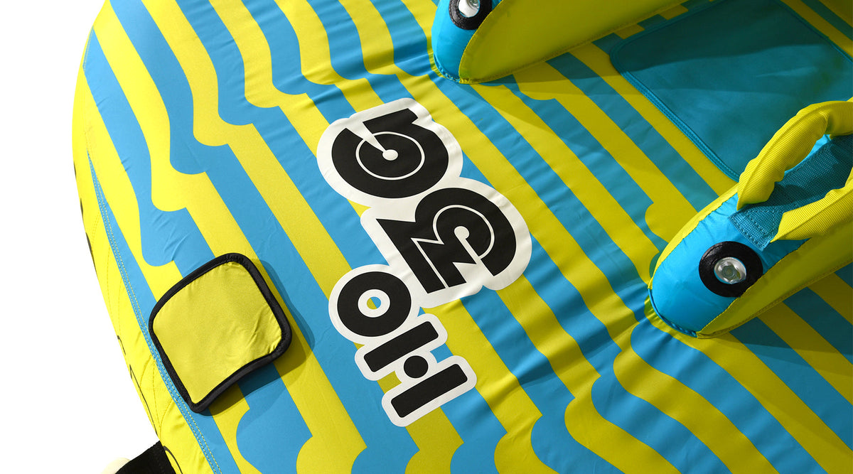 Close-up of the HO 3G logo, grab handles, and a padded panel on the blue and yellow deck.