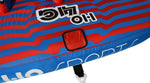 Angled top view of 4G Tube with red square patch and striped blue pattern.