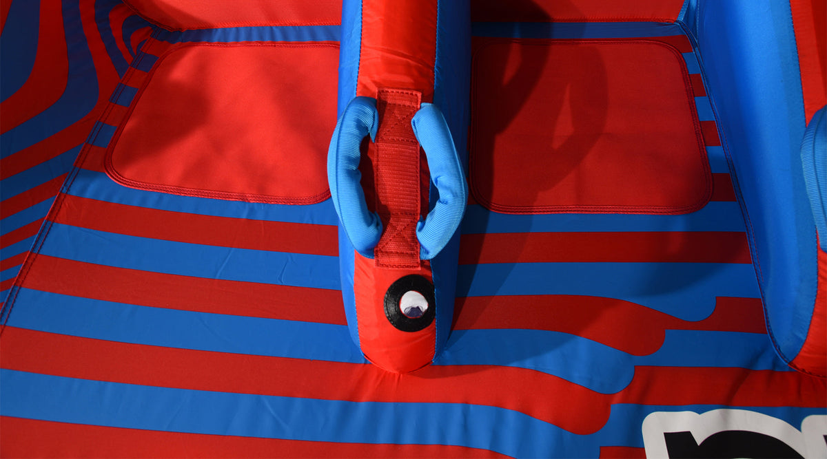 Close-up of the 4G Tube's center grab handle and knuckle guard between two seat pads.