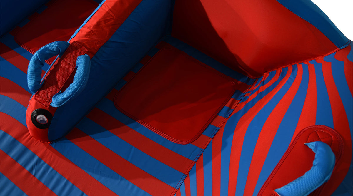 Close-up of the 4G Tube's foam grab handles and center backrest on the striped deck.