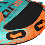 Close-up view of Glide 2 Tube black pad and orange grab handles on teal and orange fabric.