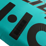 Close-up view of Glide 2 Tube large black HO logo printed on teal surface.
