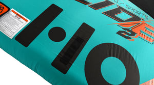 Close-up of the black HO graphic beside a warning label on the teal deck.