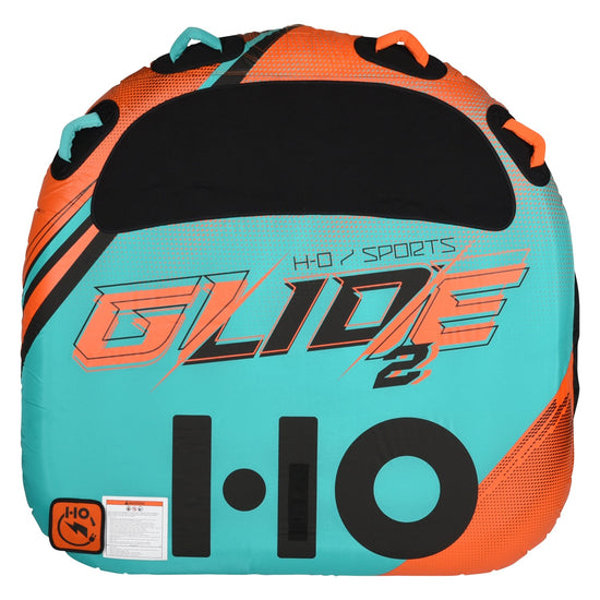 Top view of the Glide 2 Tube in teal and orange with a halftone dot pattern, black center pad, and grab handles.
