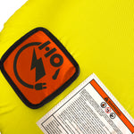 Close-up view of Glide 3 Tube logo patch and warning label on yellow fabric.