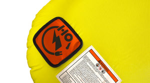 Close-up view of Glide 3 Tube logo patch and warning label on yellow fabric.