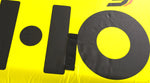 Close-up view of Glide 3 Tube large black logo on bright yellow surface.