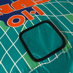 Close-up top view of Laguna 2 Tube with teal square patch on grid design.