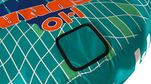 Close-up top view of Laguna 2 Tube with teal square patch on grid design.