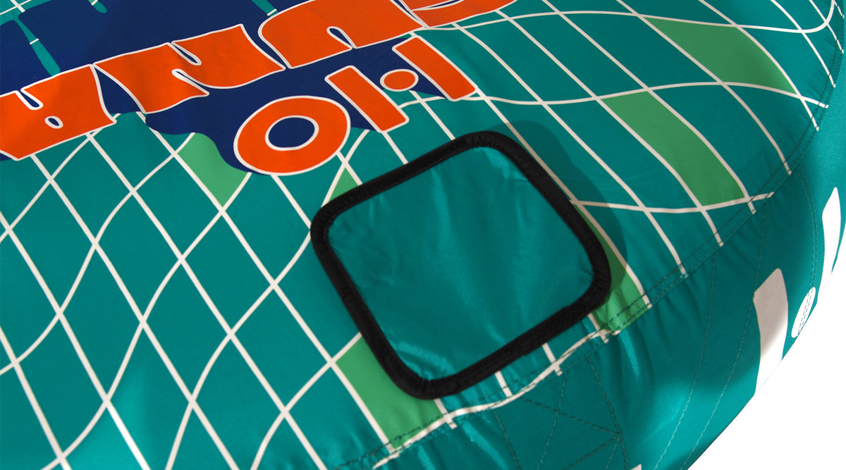 Close-up of the HO Laguna 2 graphic and a padded panel on the teal grid-patterned fabric.