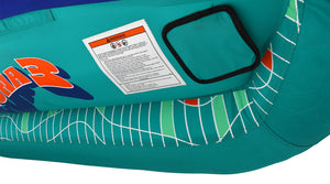 Close-up of a padded panel and a warning label on the teal grid-patterned fabric.