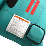 Close-up view of Tomcat Tube corner with warning label on teal surface.