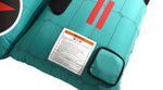 Close-up view of Tomcat Tube corner with warning label on teal surface.