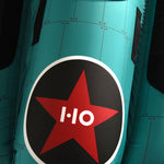 Close-up view of Tomcat Tube red star logo printed on teal surface.