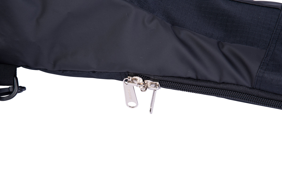 Close-up of the Hovercraft Bag's dual zipper pulls along the black padded edge.