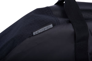 Close-up of the Hovercraft Bag's grey HO Skis label near the webbing carry handle.