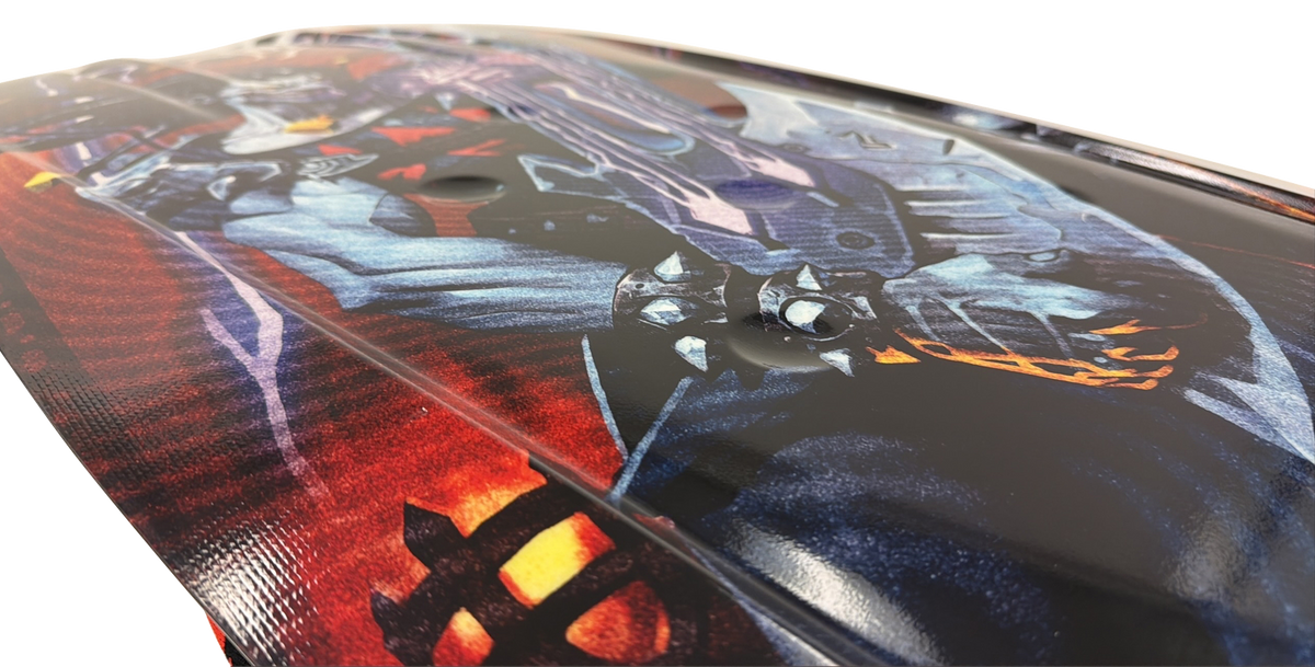 Close-up of the Joker kneeboard's underside graphic showing the joker character and spiked guitar.