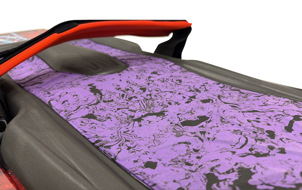 Close-up of the Joker kneeboard's purple and black marbled traction pad and red Powerlock strap.