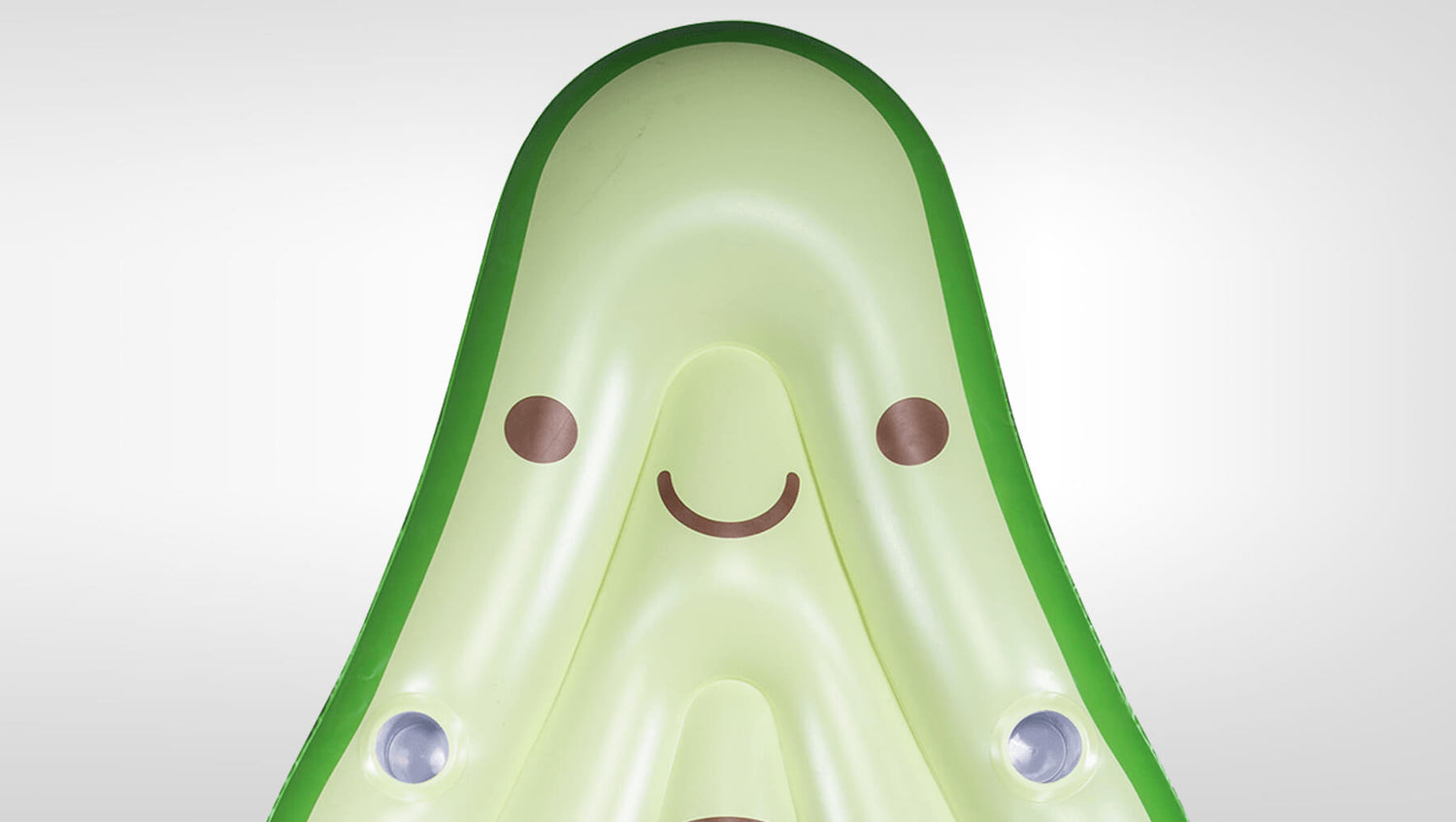 Close-up of Avocado Lounger's light green avocado face graphic with cup holders and cute illustrated expression.