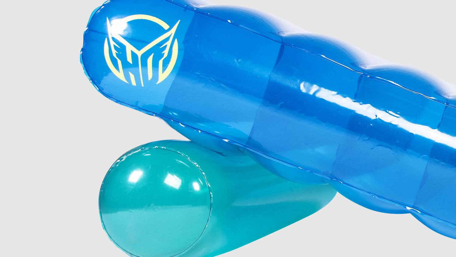 Close-up of Chaise Multi-Lounger's blue inflatable headrest with HO Sports logo and teal bolster pillow.