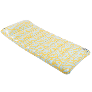 Angled view of the Lounge Mat, an inflatable float with a yellow and white abstract pattern and a cushioned design.