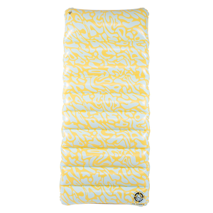Top view of the Lounge Mat, featuring a yellow and white abstract pattern with a quilted inflatable surface.