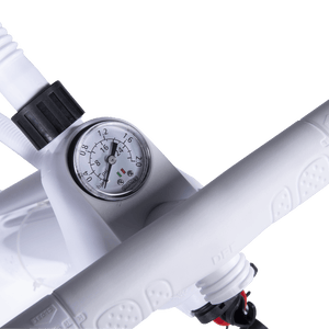 Close-up of the Dual-Action Hand Pump's pressure gauge marked in psi and bar.