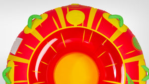 Top-down view of Citrus Tube showing red and yellow citrus print, green handles, and open center.