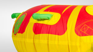 Close-up of Citrus Tube's red and yellow surface with green padded handles and HO Sports logo.