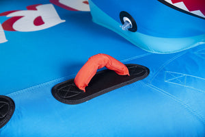 Close-up of Shark tube's blue surface with orange padded handle, black grip pad, and shark head detail.