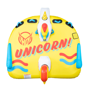Top view of Unicorn, a yellow inflatable towable with "Unicorn!" printed in red and blue, showing the unicorn head and tail.