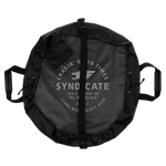 Cinched view of the Syndicate Cinch Changing Mat, showing a secured storage shape with reinforced handles and durable fabric.