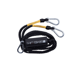 Angled view of the Rope Boat Tow Harness in black, coiled rope with metal clips and an HO Skis logo float.