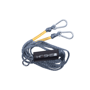 Angled view of the Rope Boat Tow Harness in grey, coiled rope with metal clips and an HO Skis logo float.