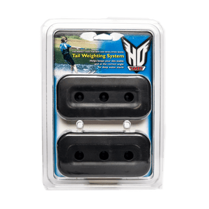 Front view of the Tail Weighting System in clear packaging with two black weights and an HO Skis logo.