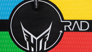 Close-up of RAD 5 kneeboard's multicolor surface with black center circle, HO Sports logo, and RAD branding.