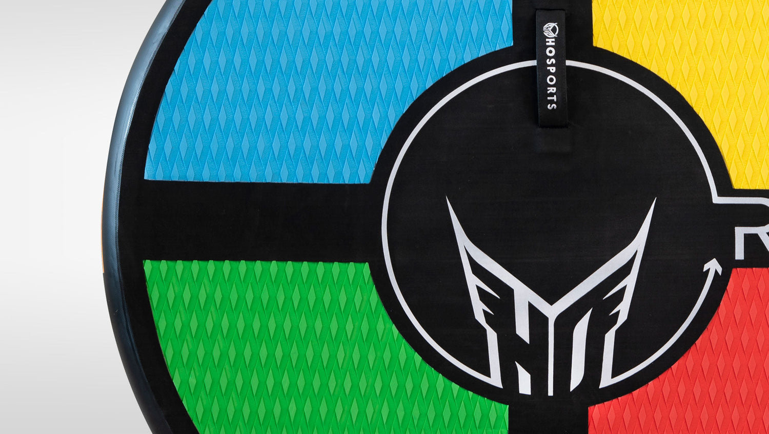 Close-up of RAD 5 kneeboard's multicolor quad sections with black center circle and HO Sports logo.