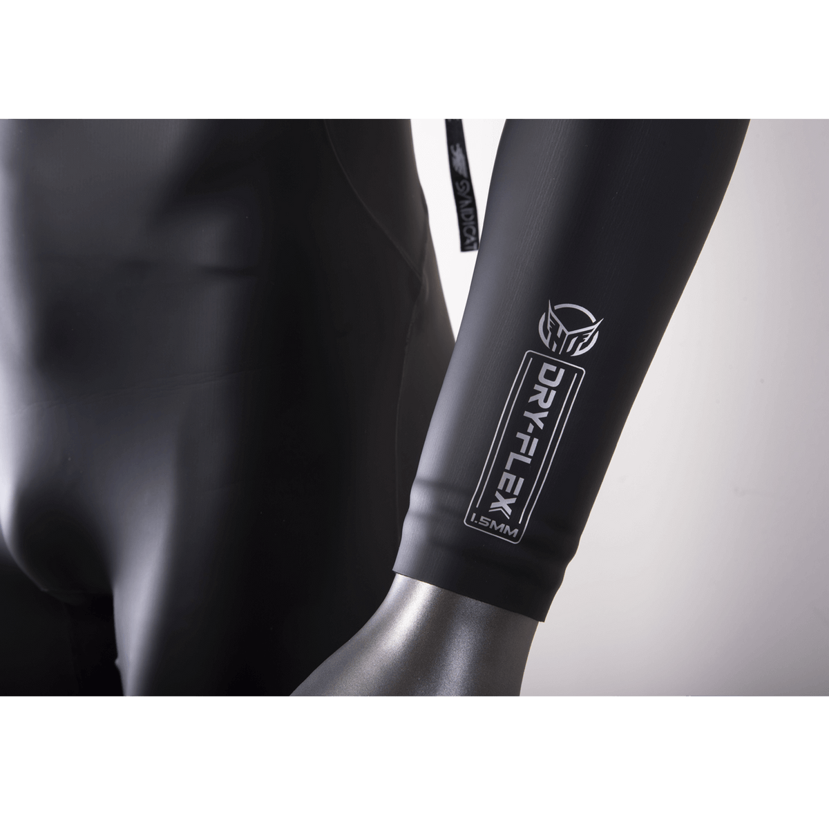 Close-up of the wetsuit sleeve, showing the Dry-Flex 1.5MM material with a sleek black finish and white logo detailing.