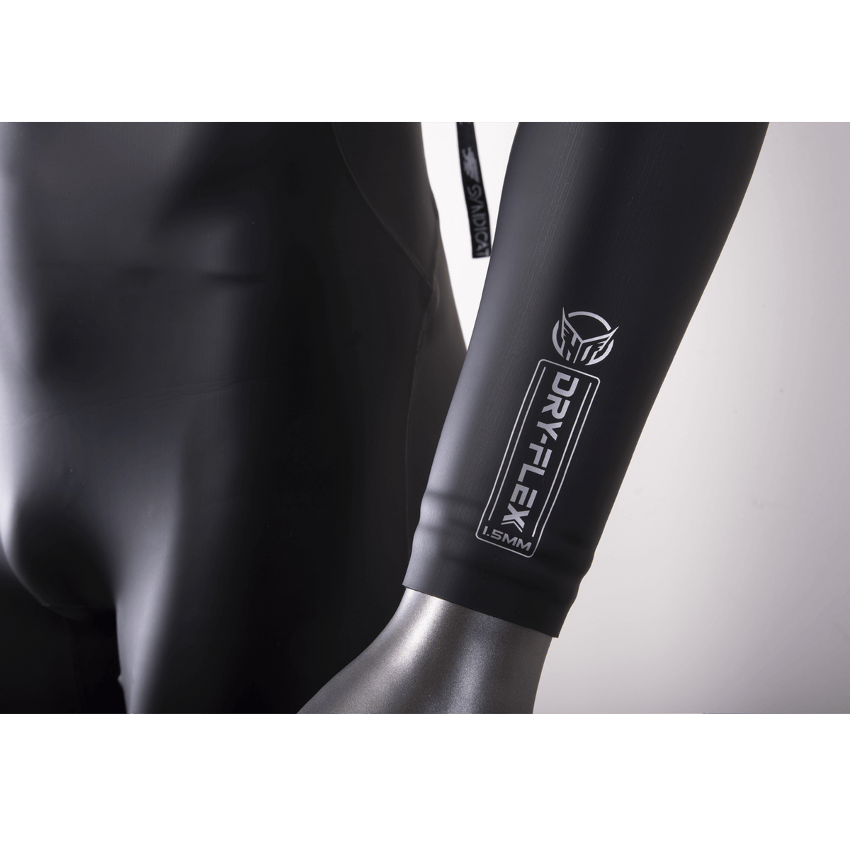 Close-up of the Syndicate Fullsuit's forearm cuff with silver DRY-FLEX and HO logo.