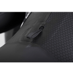 Close-up of the wetsuit’s hex-textured panel, featuring a reinforced pull tab for adjustments and added durability.