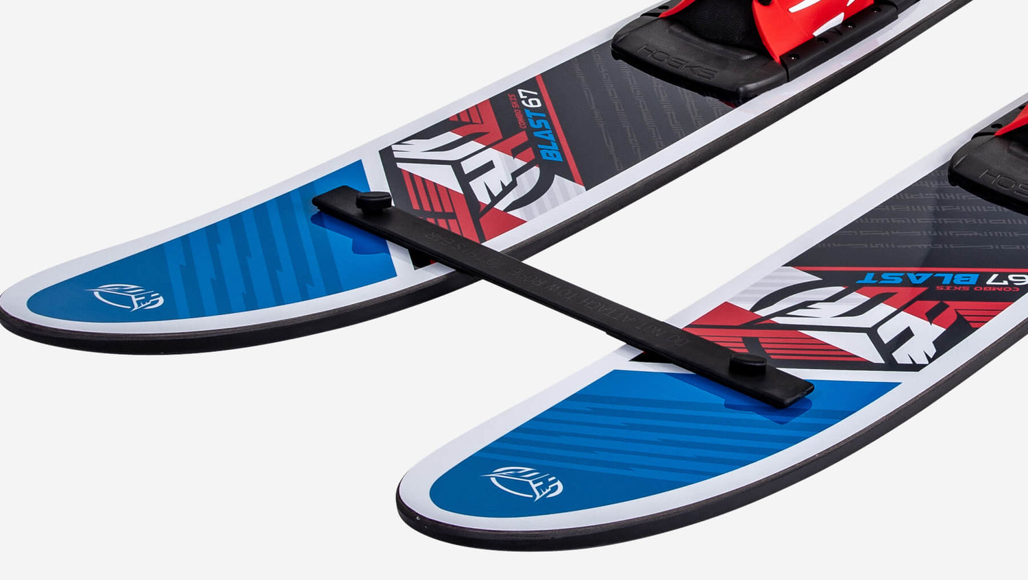 Two red white and blue water skis attached at the tips with a training bar with a HO Sports logo on a white background